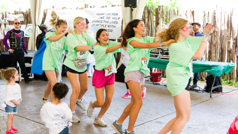 YAC Members Congo Line at Walk With Me