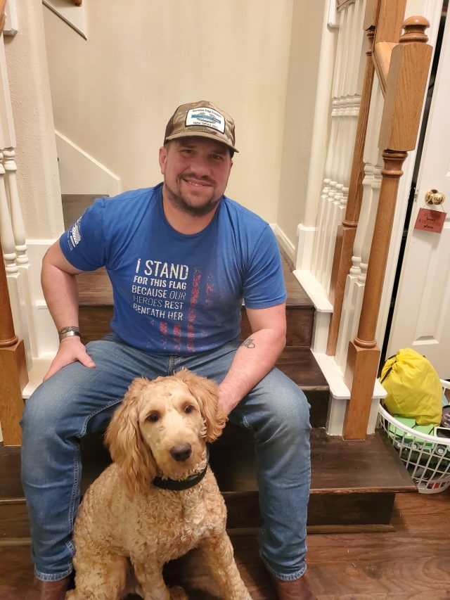 Veteran and Service Dog smiling