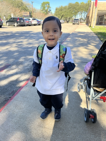 Matthew smiling with backpack on for first day of school