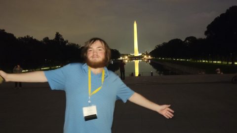 Kaden posing in front of the Washington monument in DC.